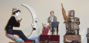 Victorian automata including the man in the moon, organ grinder, and spinning lady