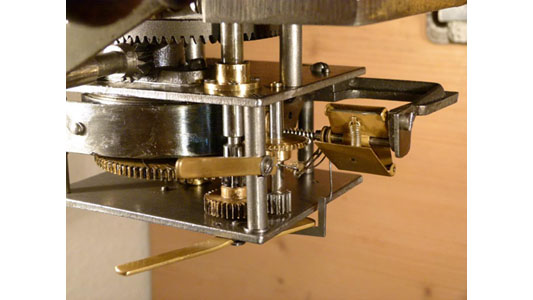 Close up of clockwork musical box movement