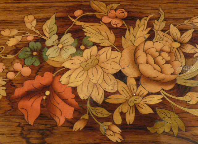 Marquetry inlay detail on lid of antique muscial box